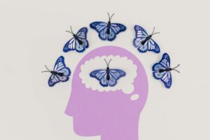 illustration of a head and butterflies around the scalp and inside the brain